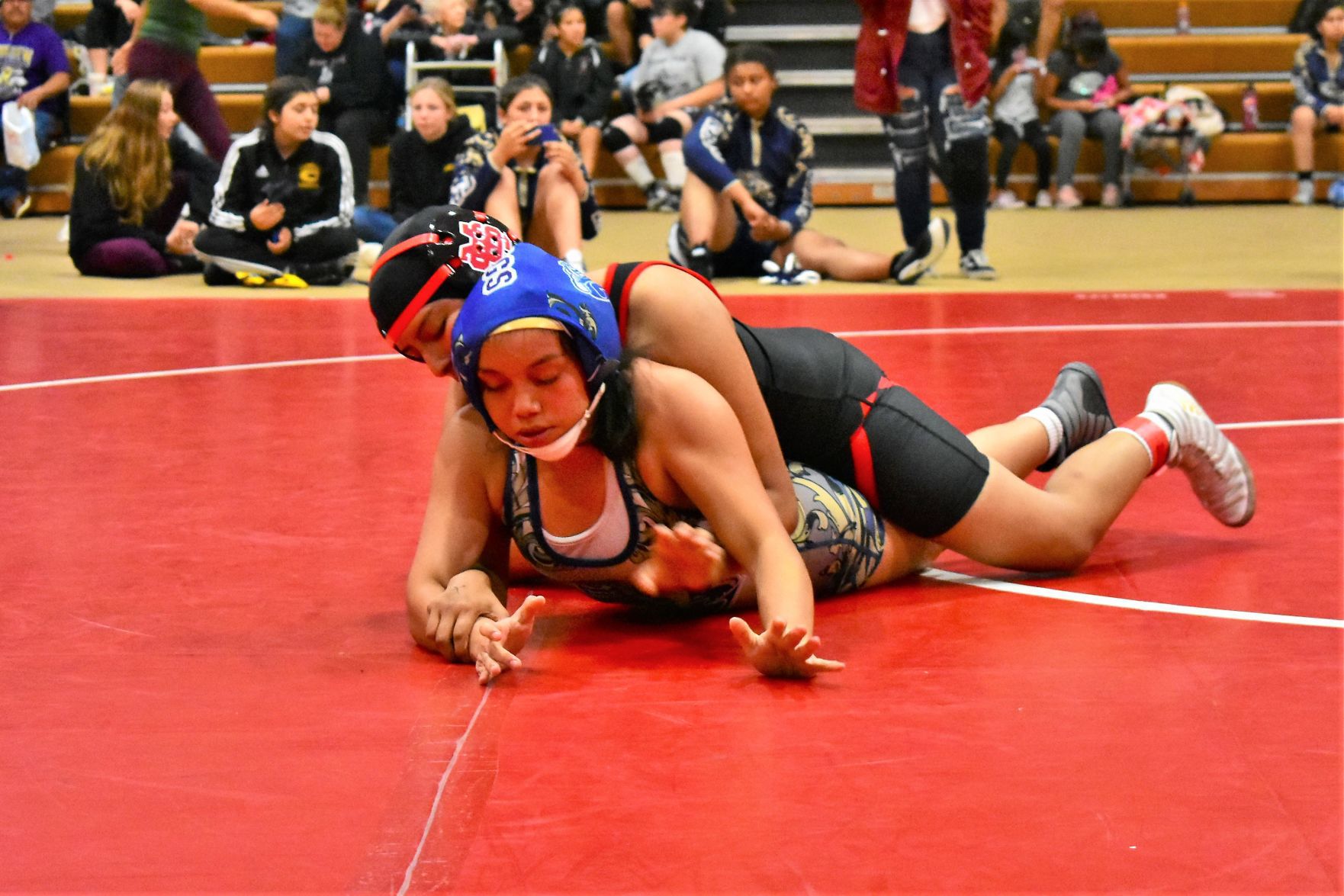 Golden Walley's Celeste Cubillo struggles to get free from Santa Maria's Jennifer Hernandez